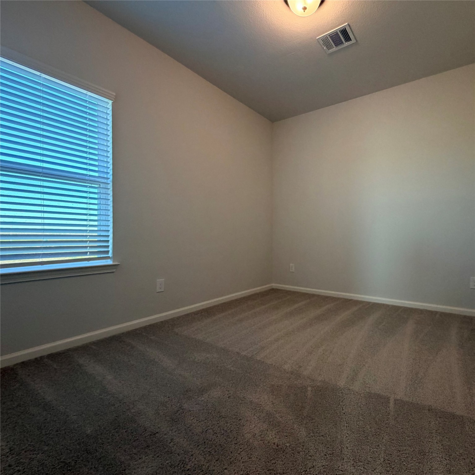3418 Lago Norence Drive Manvel, TX 77578 - Photo 15 of 18 an empty room with a window