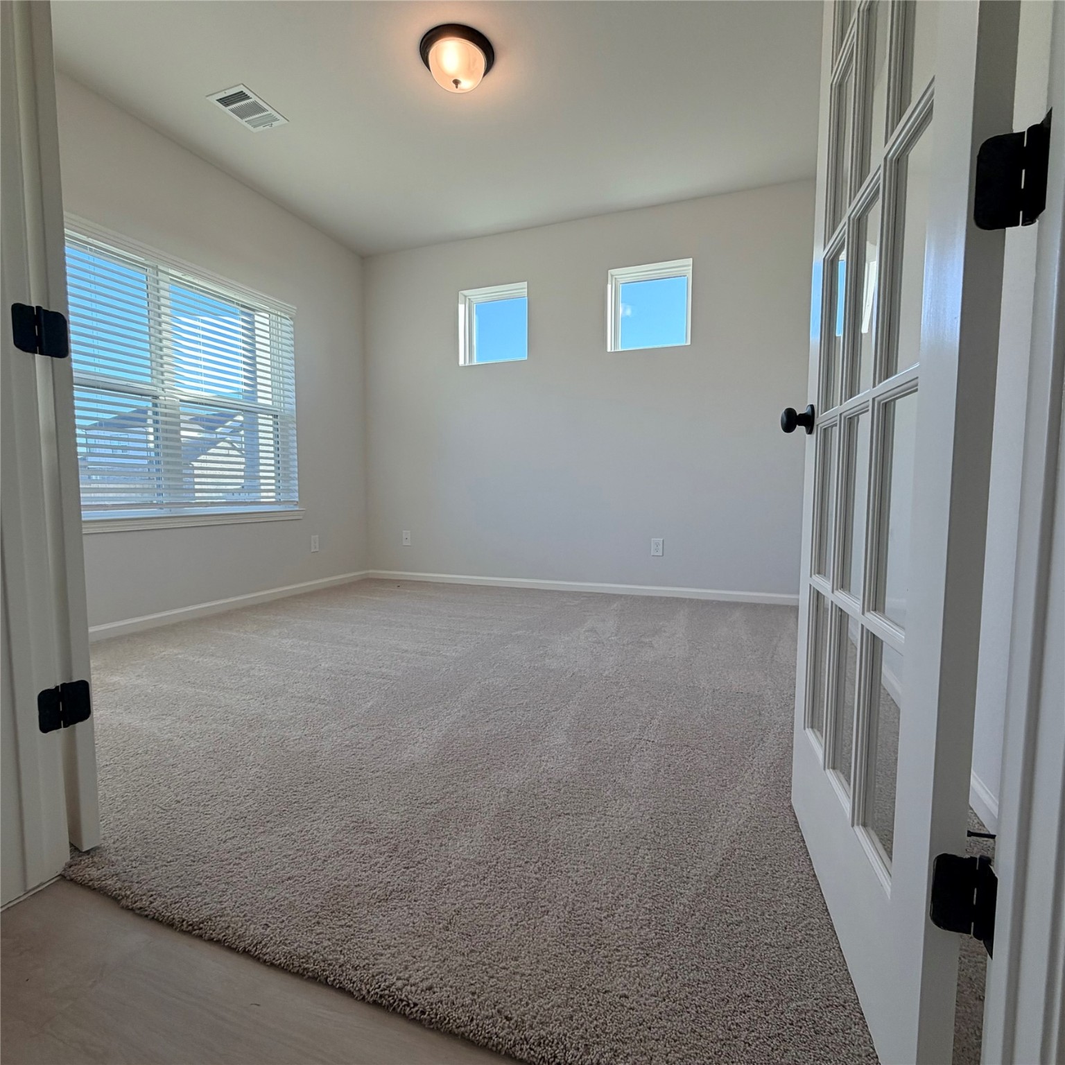 3418 Lago Norence Drive Manvel, TX 77578 - Photo 3 of 18 an empty room with windows