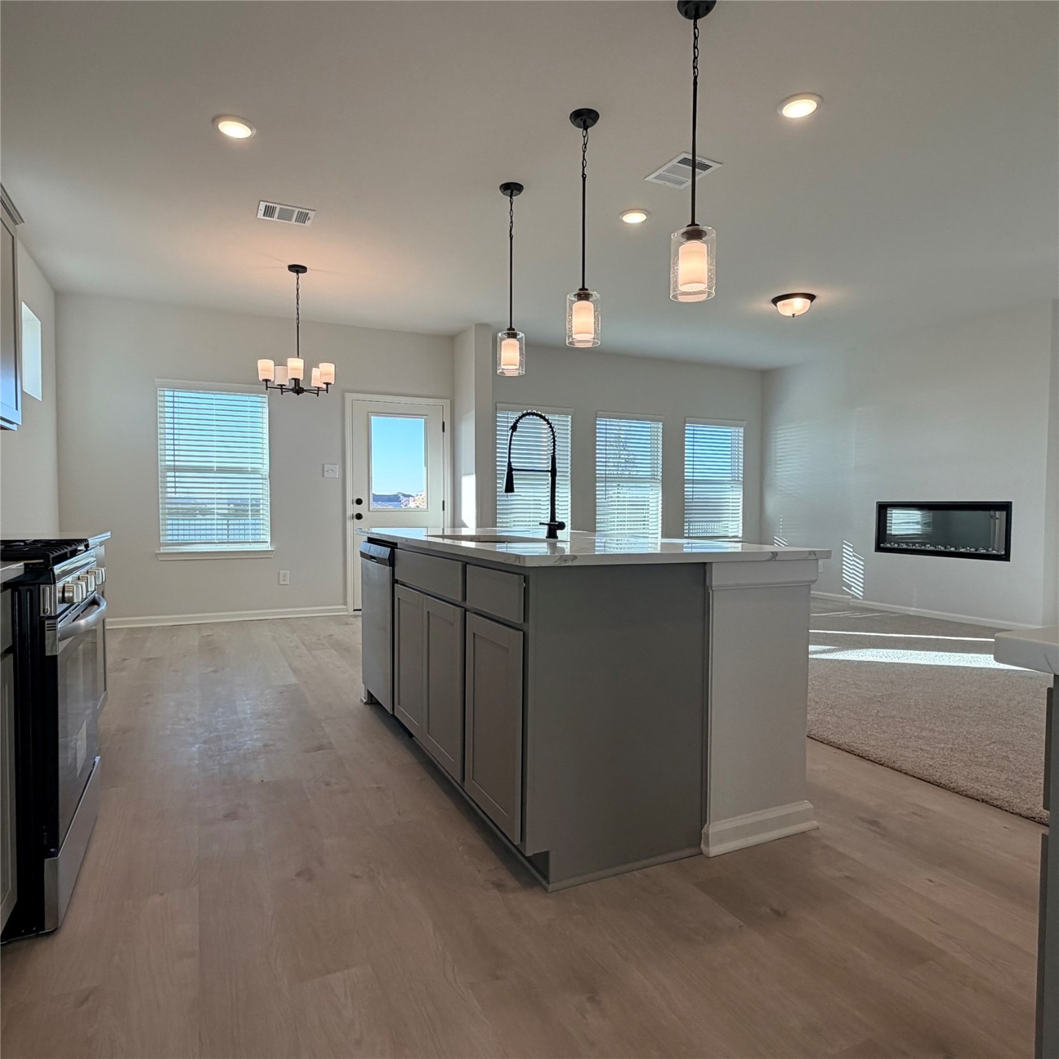 3418 Lago Norence Drive Manvel, TX 77578 - Photo 6 of 18 a large kitchen with a large counter top and kitchen view