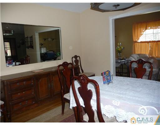 74 Harmon Road Edison, NJ 08837 - Photo 4 of 9 a view of a bedroom with furniture and window