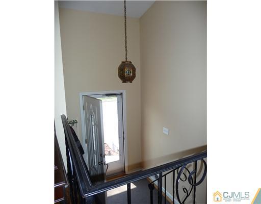 74 Harmon Road Edison, NJ 08837 - Photo 6 of 9 a view of a hallway with windows