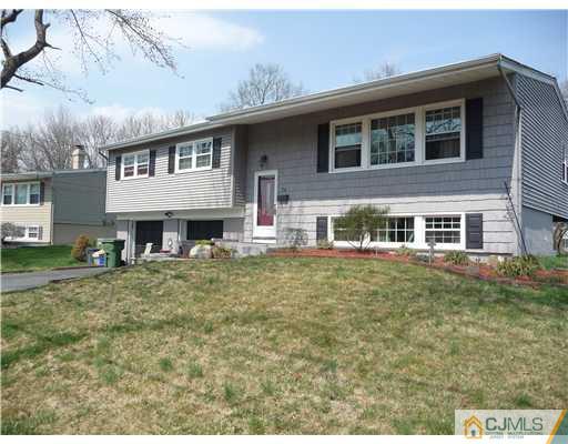 74 Harmon Road Edison, NJ 08837 - Photo 9 of 9 a front view of a house with a yard
