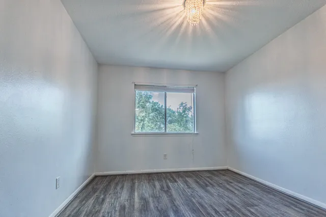 a very nice looking hallway with wooden floor