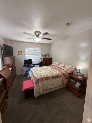 641 East Greystone Way Tooele, UT 84074 - Photo 8 of 30 Carpeted room featuring a ceiling fan with integrated lighting, a window with horizontal blinds, and a built-in smoke detector