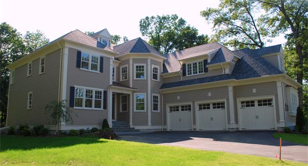 26 Tanglewood Road Wellesley, MA 02481 - Photo 1 of 16 a front view of a house with a yard