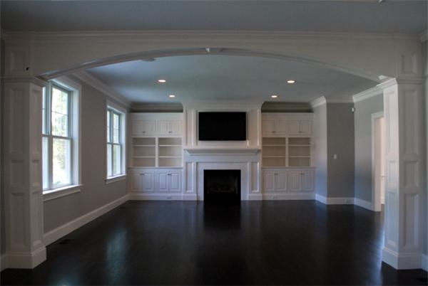 26 Tanglewood Road Wellesley, MA 02481 - Photo 12 of 16 a living room with a fireplace and a floor to ceiling window