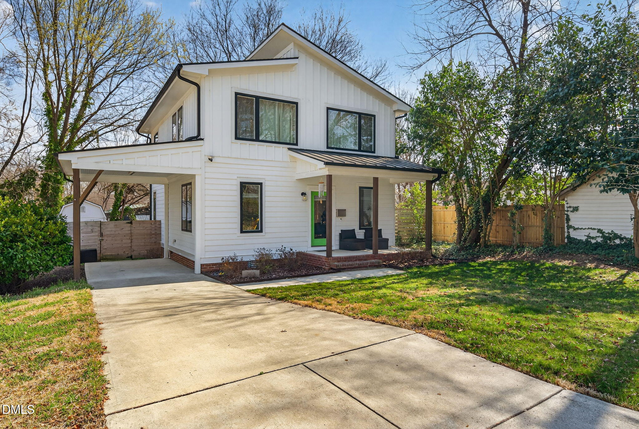 213 Lincoln Court Raleigh, NC 27610 - Photo 2 of 40 a front view of a house with a yard and trees