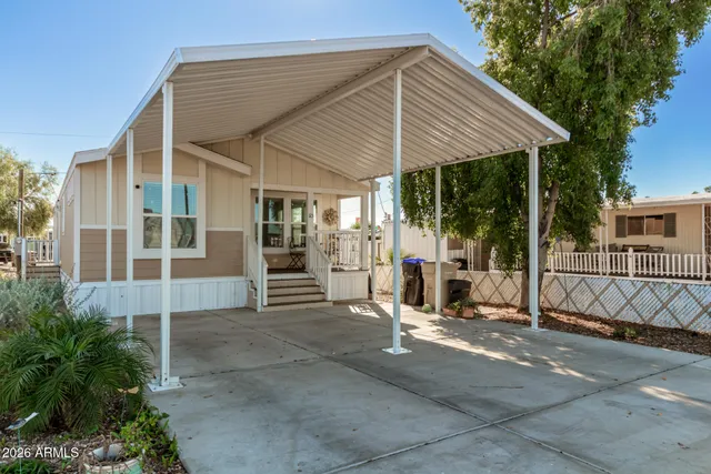 a view of a house with backyard and porch