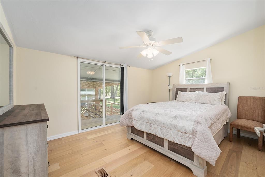 7870 Southwest 25th Place Bell, FL 32619 - Photo 83 of 99 a bed room with a bed and a chair