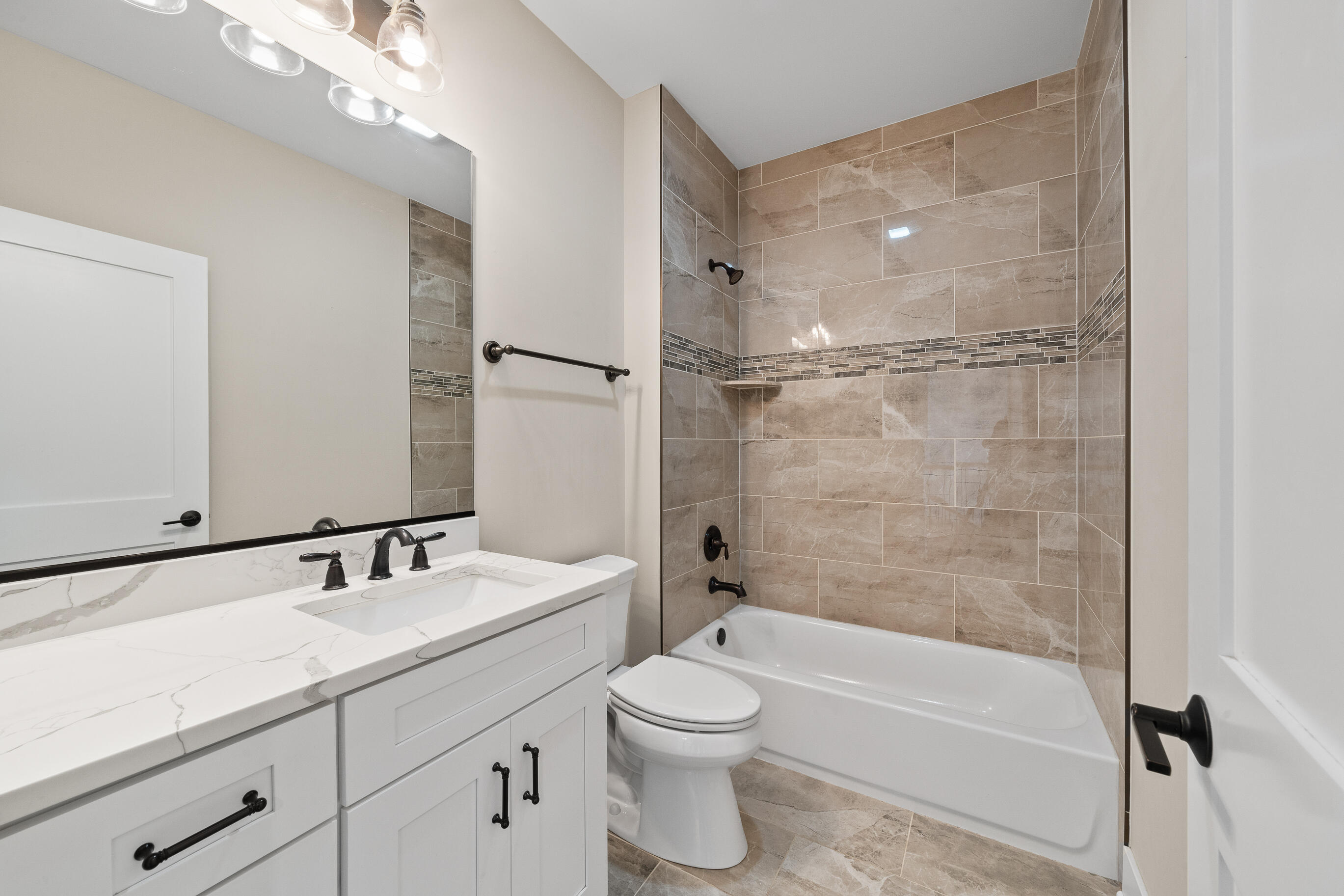 460 Stone Ridge Drive, Unit 480 Lake Geneva, WI 53147 - Photo 21 of 37 custom tile bathrooms in both units