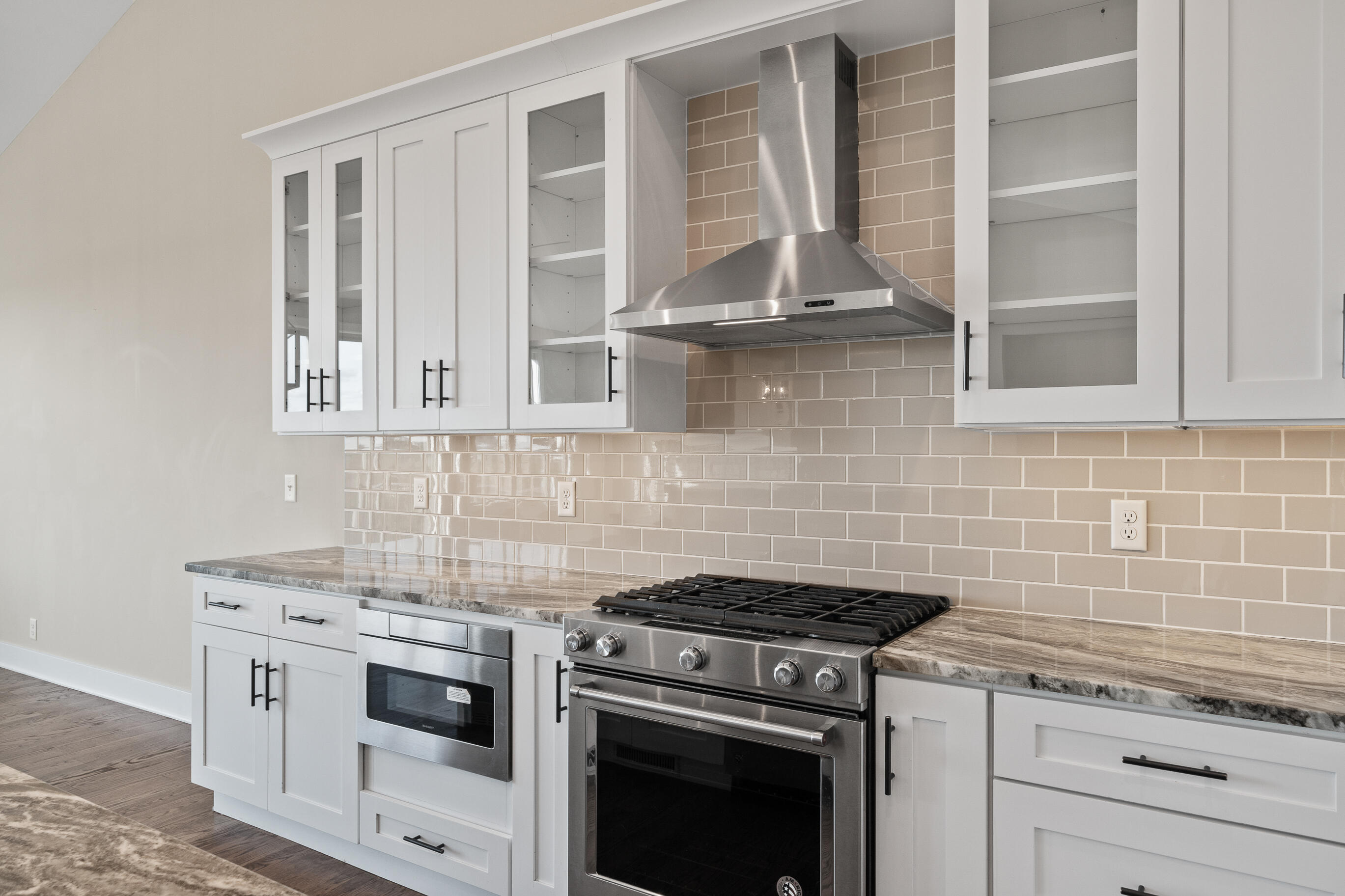 460 Stone Ridge Drive, Unit 480 Lake Geneva, WI 53147 - Photo 6 of 37 Tile backsplashes in both units with gas stoves and soft close cabinetry