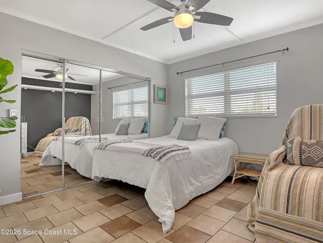 a bed room with a bed and a chandelier