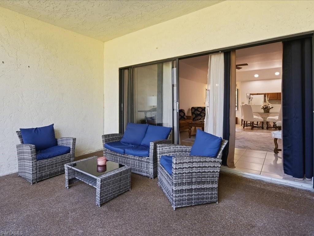 1833 Courtyard Way, Unit E105 Naples, FL 34112 - Photo 18 of 28 View of patio / terrace featuring an outdoor living space