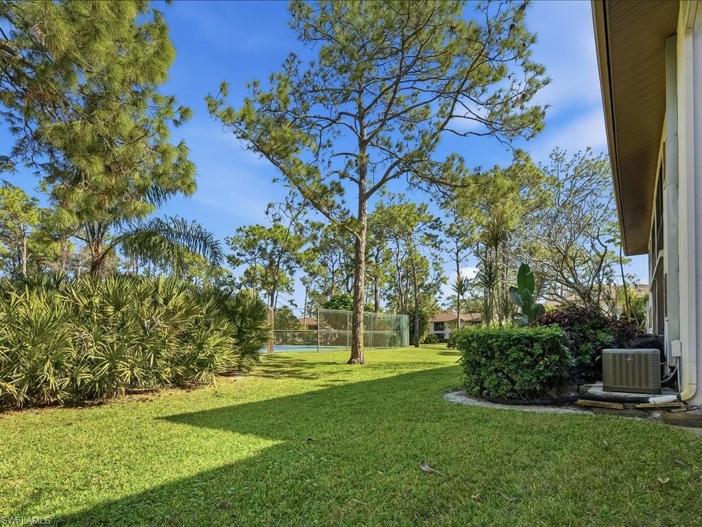 1833 Courtyard Way, Unit E105 Naples, FL 34112 - Photo 21 of 28 View of yard