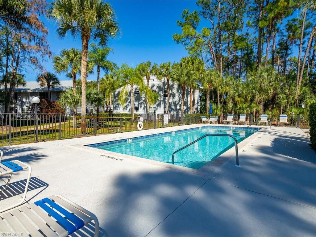 1833 Courtyard Way, Unit E105 Naples, FL 34112 - Photo 25 of 28 Community pool with a patio