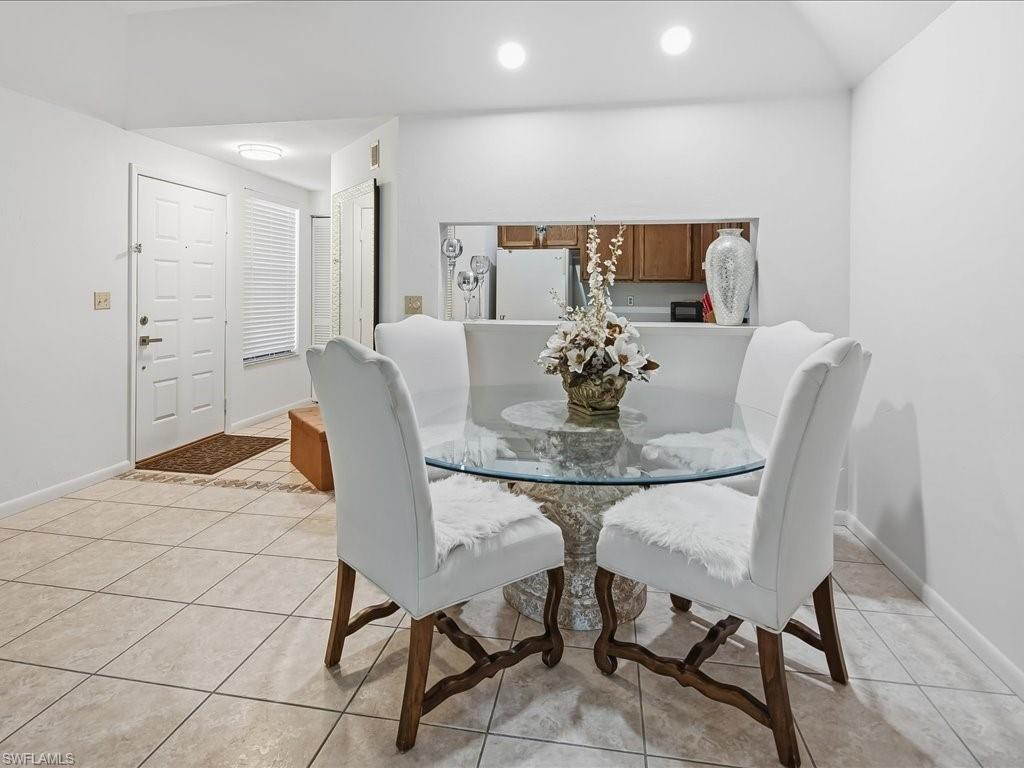 1833 Courtyard Way, Unit E105 Naples, FL 34112 - Photo 4 of 28 Dining space featuring light tile patterned floors and recessed lighting
