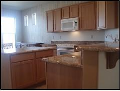 16551 West Berkeley Road, Unit 58 Goodyear, AZ 85395 - Photo 10 of 14 KITCHEN WITH BREAKFAST BAR