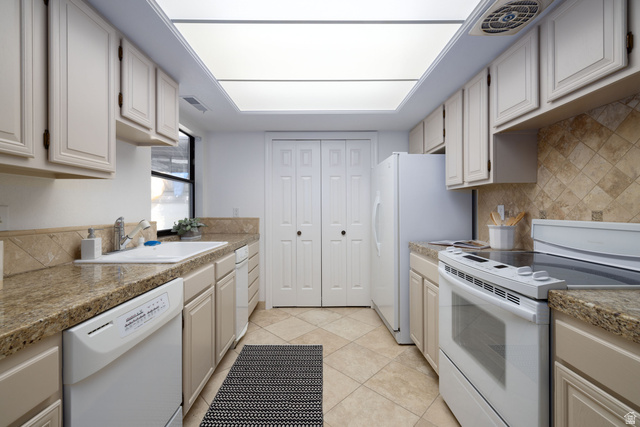 6936 South 775 East, Unit B Midvale, UT 84047 - Photo 9 of 33 Kitchen with white appliances, light tile patterned floors, and tasteful backsplash
