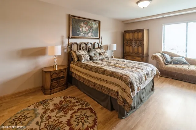 a bedroom with a bed and a couch