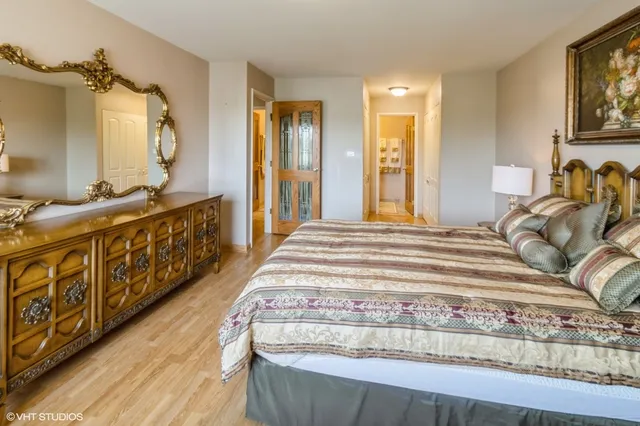 a bedroom with wooden floor