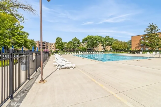 a view of a backyard with wooden fence