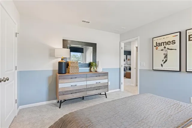 a room with a bed and a mirror