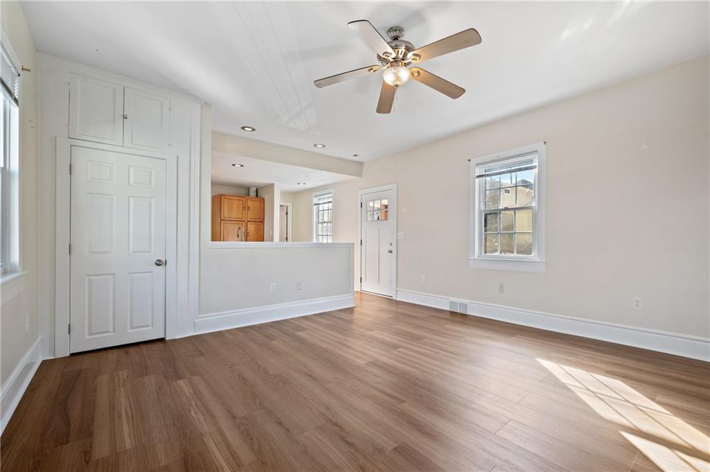 320 Newkirk Avenue Carnegie, PA 15106 - Photo 13 of 25 an empty room with wooden floor fan and windows