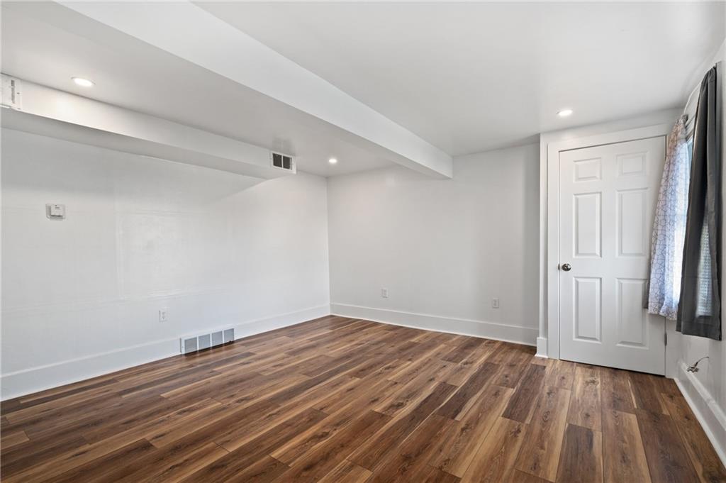 320 Newkirk Avenue Carnegie, PA 15106 - Photo 17 of 25 wooden floor in an empty room with a window