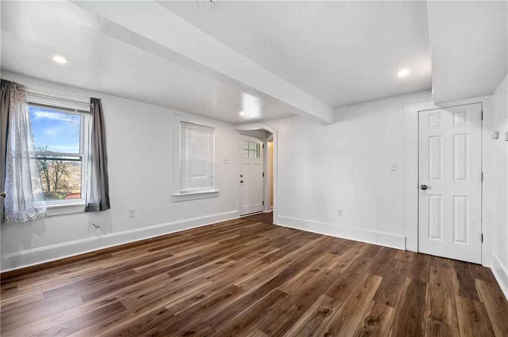 320 Newkirk Avenue Carnegie, PA 15106 - Photo 18 of 25 a view of an empty room with wooden floor and window