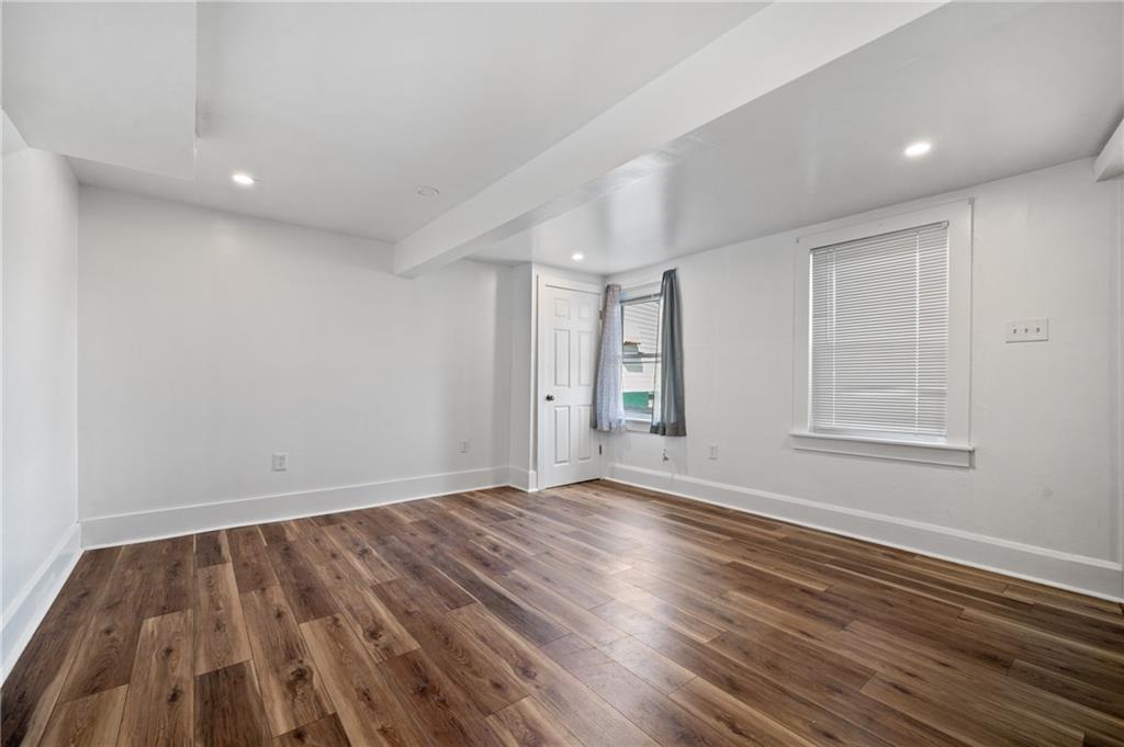 320 Newkirk Avenue Carnegie, PA 15106 - Photo 19 of 25 a view of an empty room with wooden floor and a window