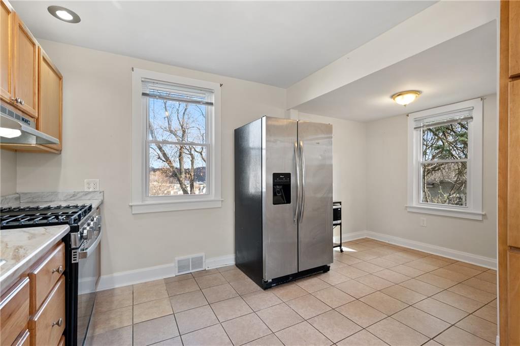 320 Newkirk Avenue Carnegie, PA 15106 - Photo 4 of 25 a kitchen with stainless steel appliances granite countertop a refrigerator and a stove top oven