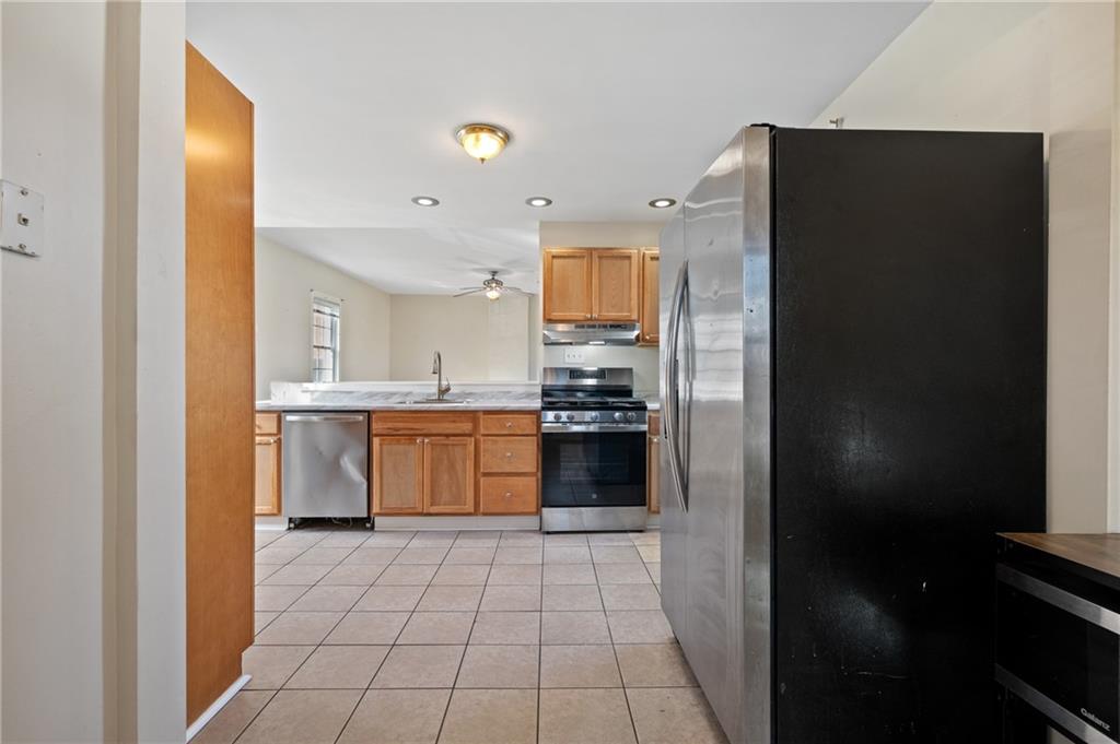 320 Newkirk Avenue Carnegie, PA 15106 - Photo 6 of 25 a kitchen with stainless steel appliances granite countertop a refrigerator and a stove