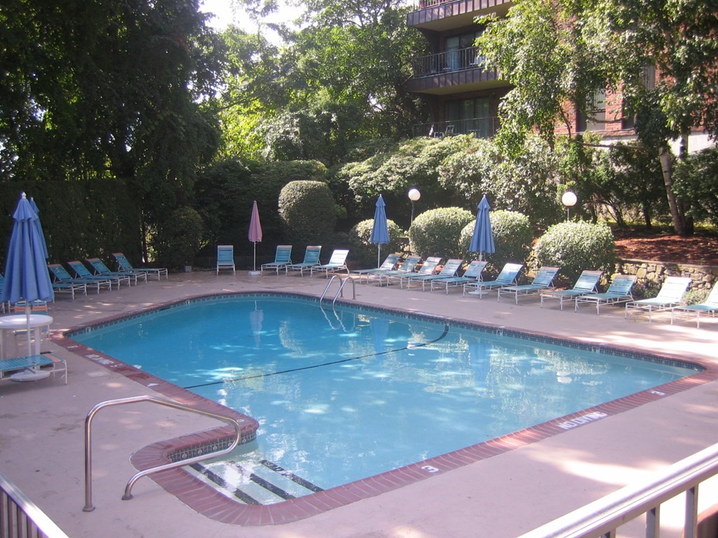 1008 Paradise Road, Unit 1O Swampscott, MA 01907 - Photo 2 of 5 a view of a swimming pool with a patio
