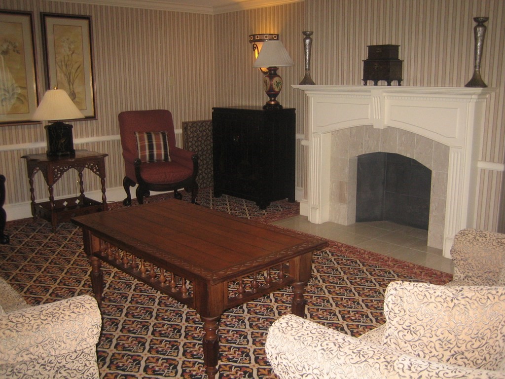 1008 Paradise Road, Unit 1O Swampscott, MA 01907 - Photo 3 of 5 a room with furniture and a fireplace