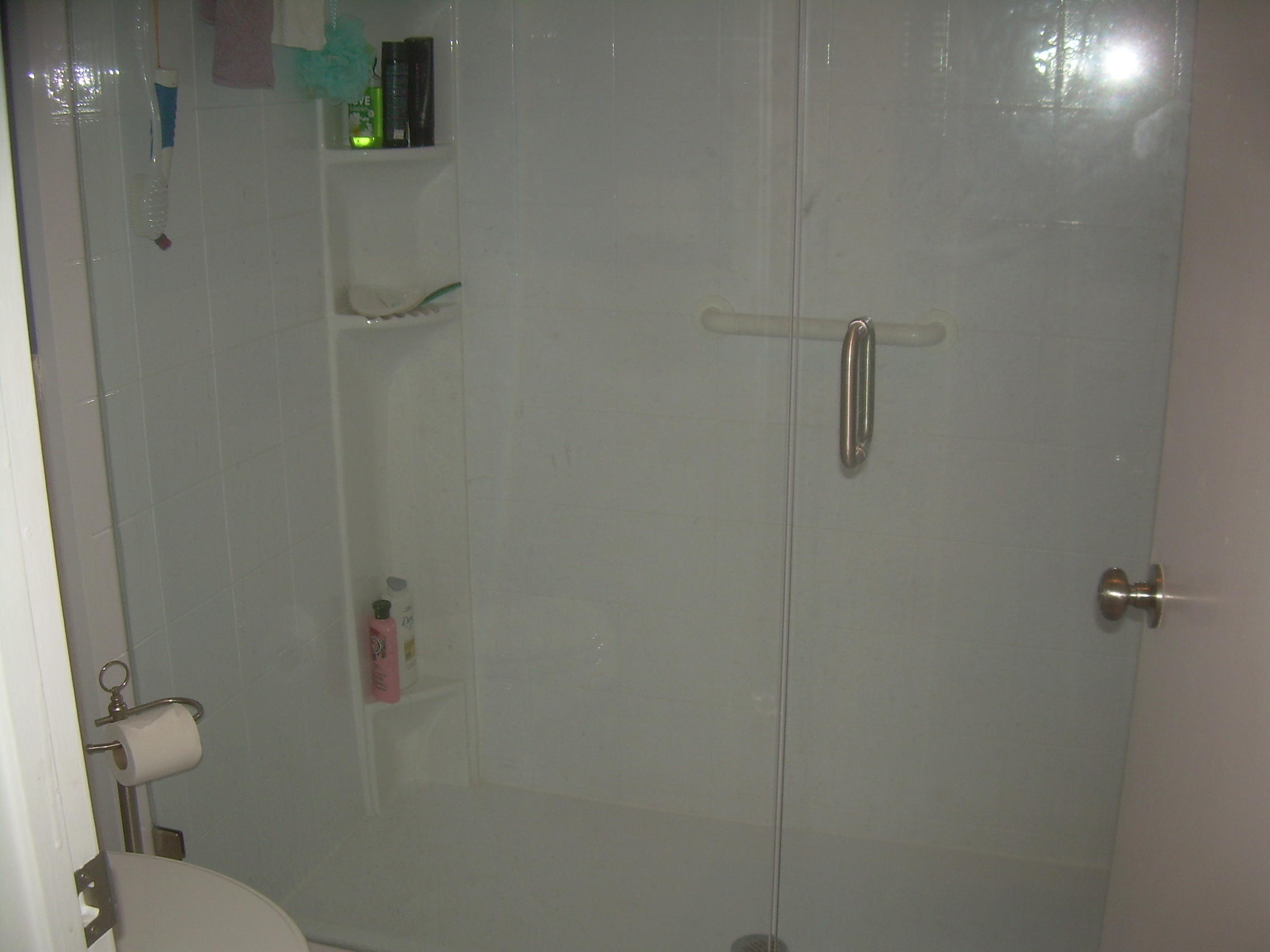 8700 Jasmine Way, Unit B Boca Raton, FL 33496 - Photo 27 of 32 a bathroom with a toilet and shower