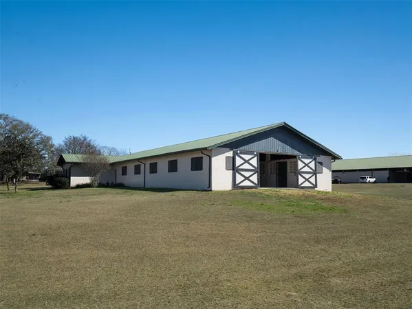 a house with trees in the background