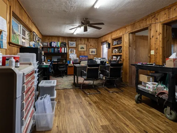 a view of a workspace with furniture and a livingroom
