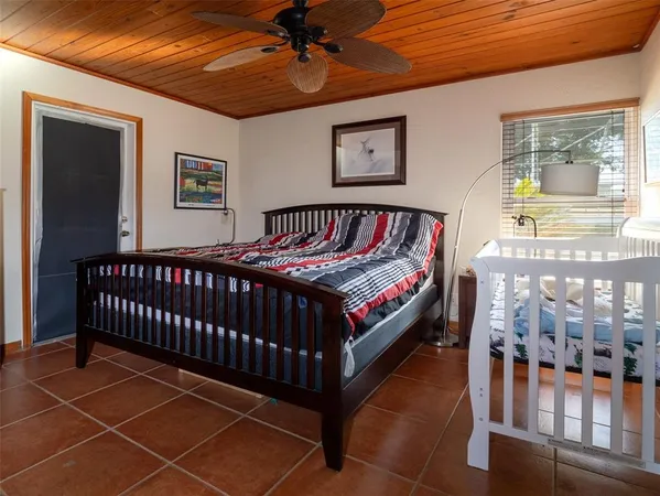 a bedroom with furniture and a window