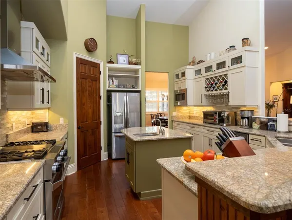 a kitchen with a stove and a refrigerator