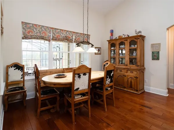 a dinning table and chairs in a room