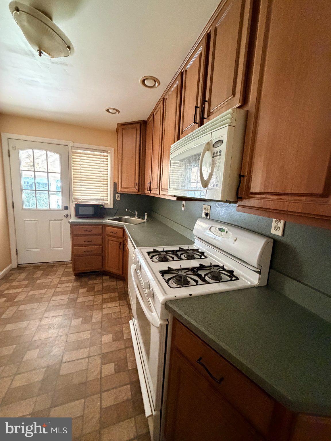 1707 Stokesley Road Baltimore, MD 21222 - Photo 4 of 18 Cozy kitchen with warm wood accents.