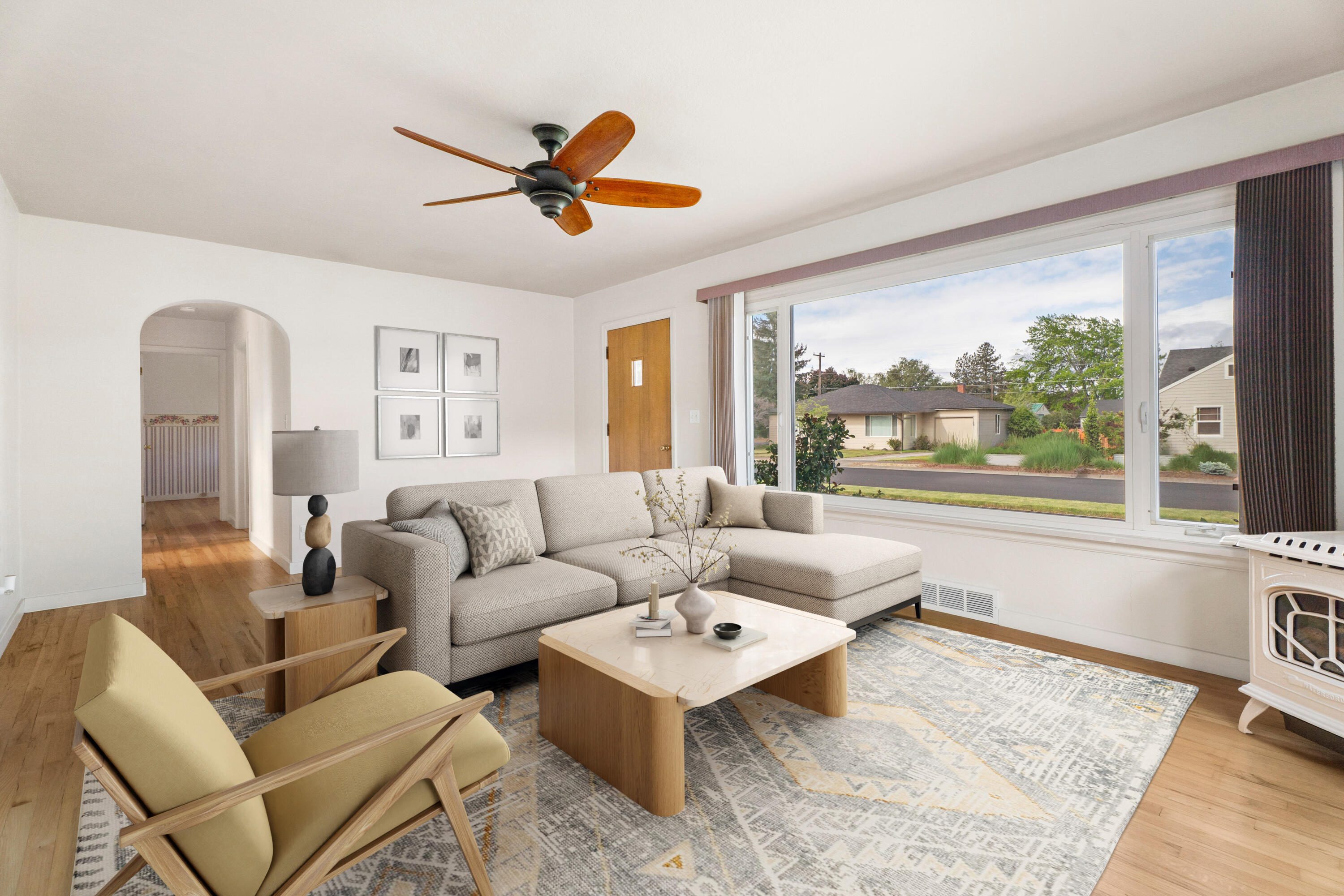 946 Southwest 13th Street Redmond, OR 97756 - Photo 5 of 49 a living room with furniture and a large window