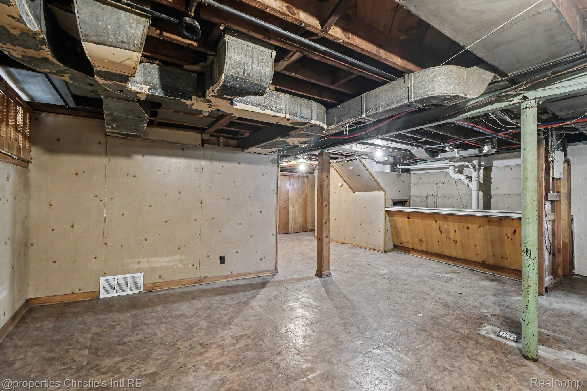 18315 Prairie Street Detroit, MI 48221 - Photo 14 of 16 Lower level featuring exposed ceiling joists and ductwork