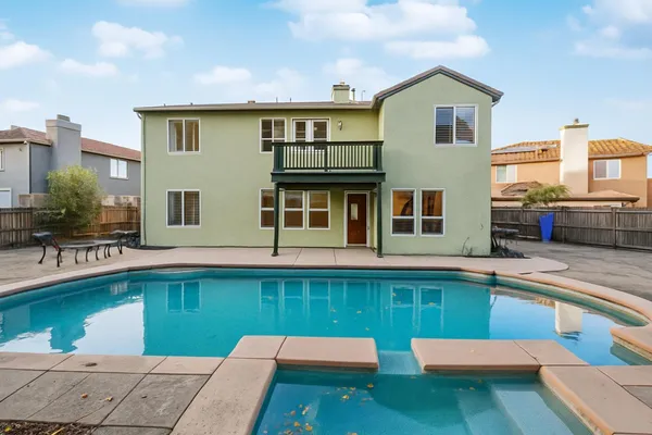 a front view of a house with swimming pool