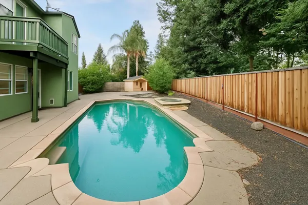 a view of swimming pool from a balcony