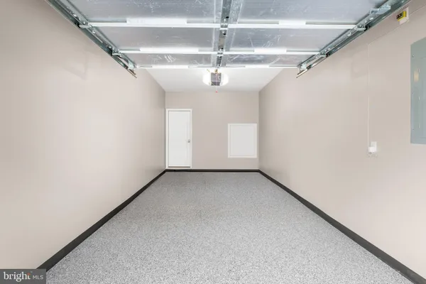 a view of a big room with chandelier fan