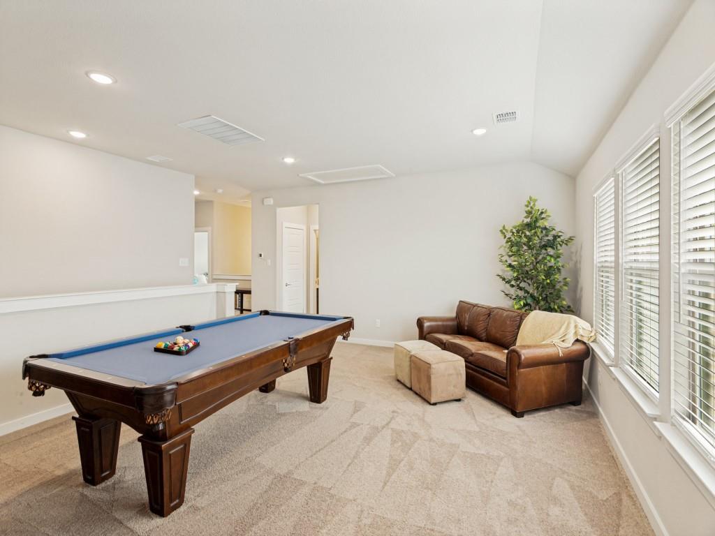 10613 Smiths Bnd Road Fort Worth, TX 76126 - Photo 14 of 29 Spacious bonus room featuring vaulted ceilings, recessed lighting, carpet flooring, a half-wall, and multiple large windows with blinds