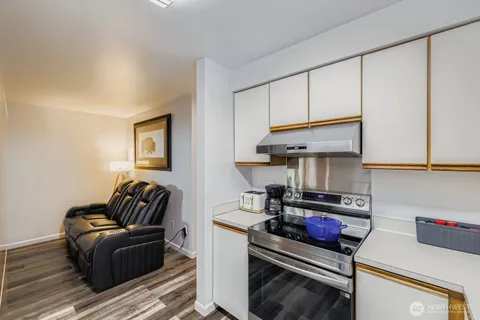 a kitchen with stainless steel appliances granite countertop a stove and a refrigerator
