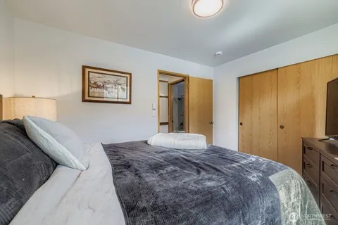 a bedroom with a bed and a dresser