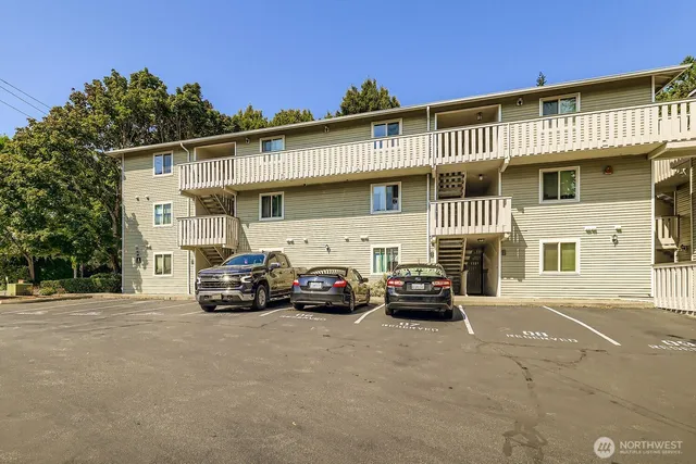 a view of a car parked in front of a building